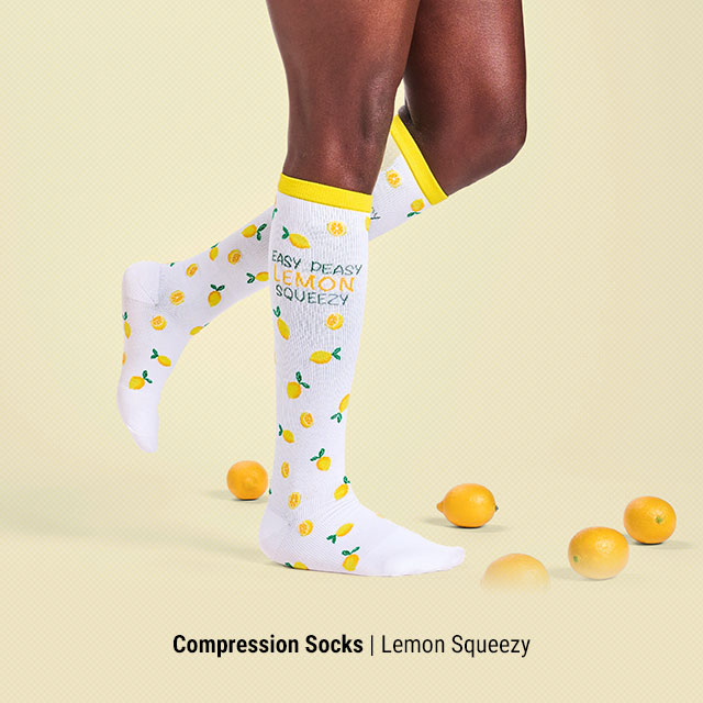 Compression Socks | Lemon Squeezy. Woman wearing the Lemon Squeezy Compression Socks in white.
